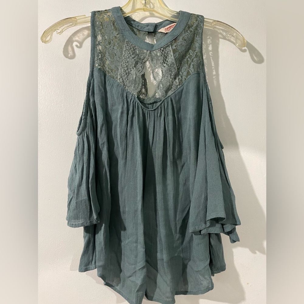 Green blouse.